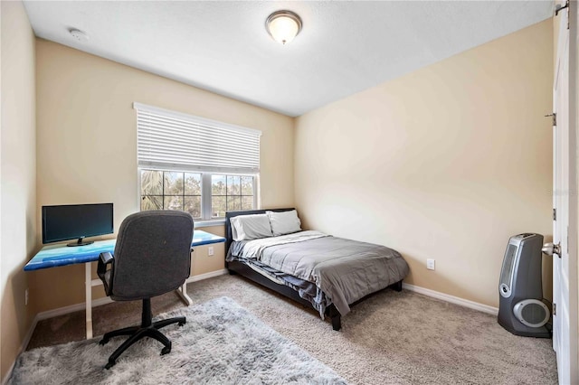 bedroom featuring light colored carpet