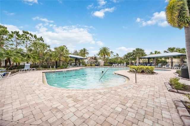 view of swimming pool with a patio