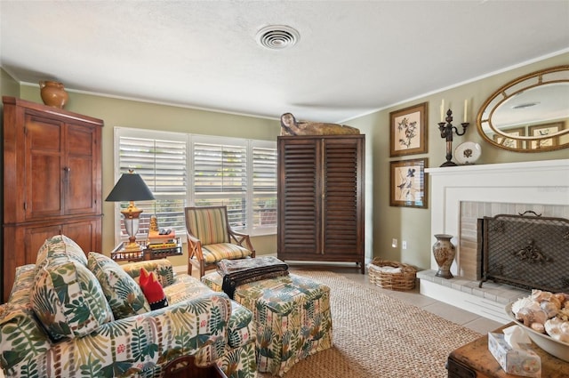 living room with light tile patterned floors, a fireplace, and ornamental molding