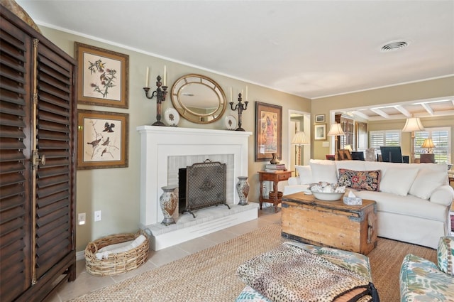 tiled living room featuring crown molding and a brick fireplace