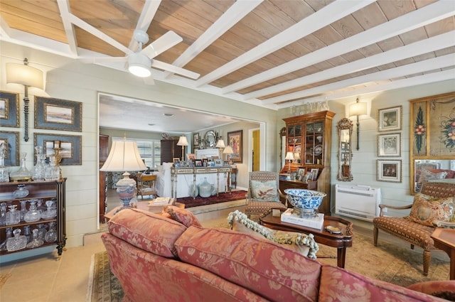 living room with beamed ceiling, heating unit, and wooden ceiling