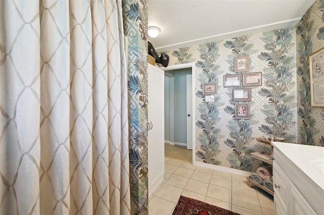 bathroom with tile patterned flooring and vanity