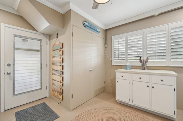 interior space featuring ornamental molding and light tile patterned floors