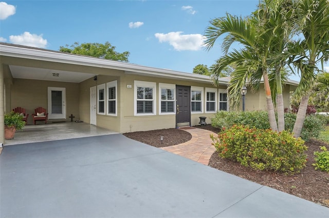 property entrance featuring a carport