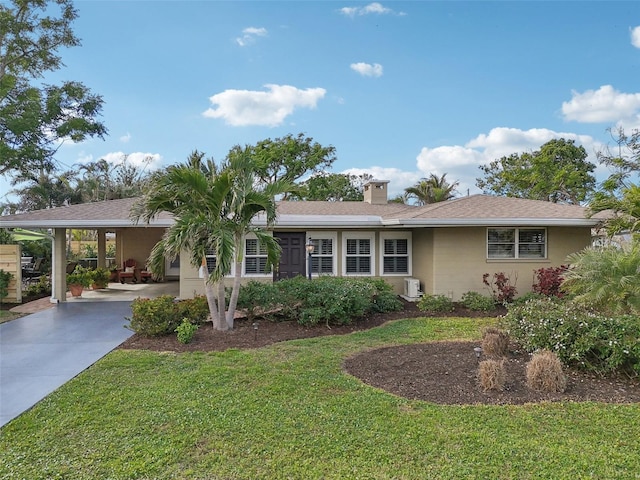 single story home with a carport and a front lawn