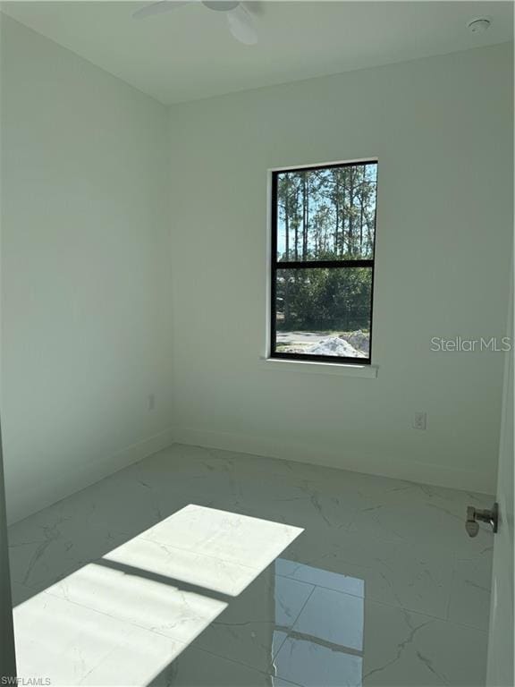 unfurnished room with ceiling fan