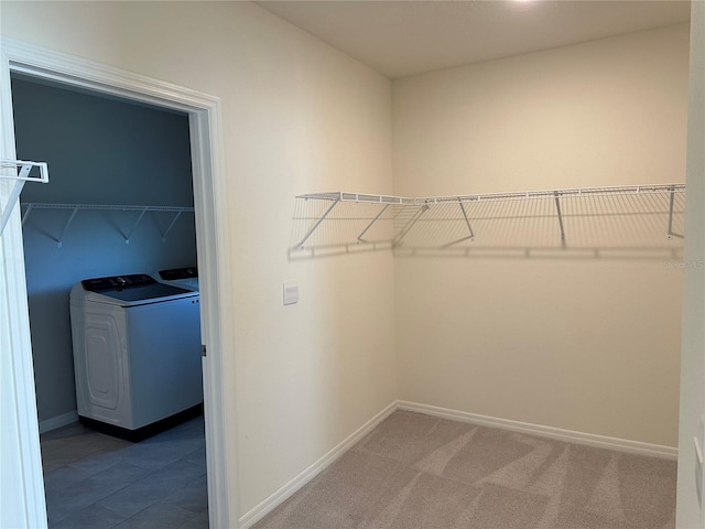 spacious closet featuring dark carpet