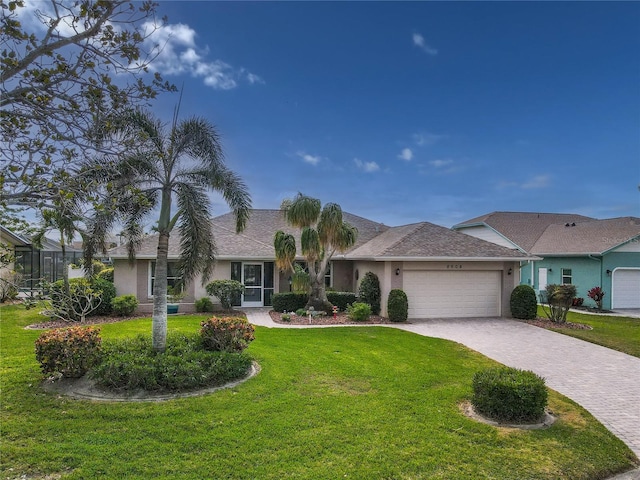 ranch-style house with a garage and a front yard