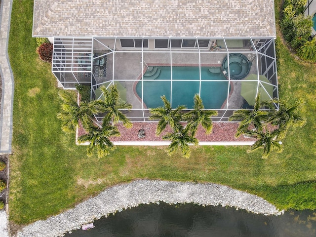 birds eye view of property with a water view