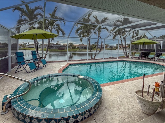 view of pool featuring a lanai, a patio area, a water view, and an in ground hot tub