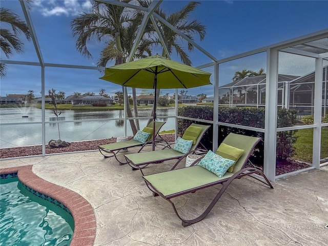 sunroom with a pool and a water view