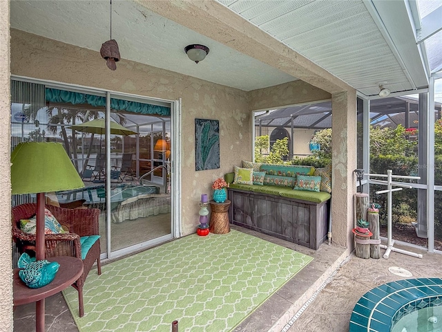 sunroom with a wealth of natural light and beamed ceiling