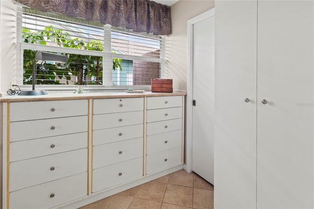 walk in closet featuring light tile patterned floors