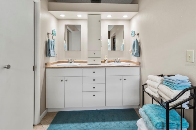 bathroom with tile patterned floors and vanity