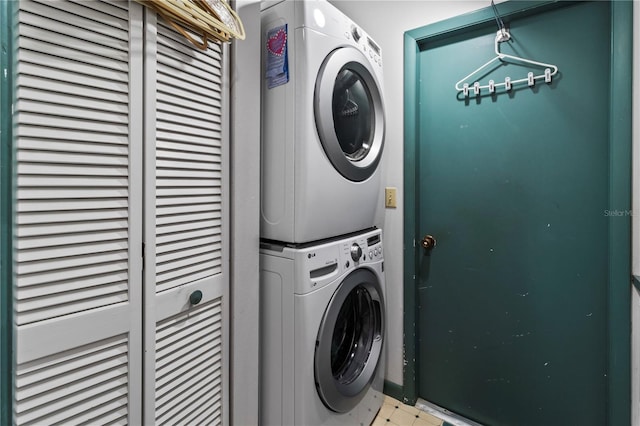 laundry room with stacked washing maching and dryer