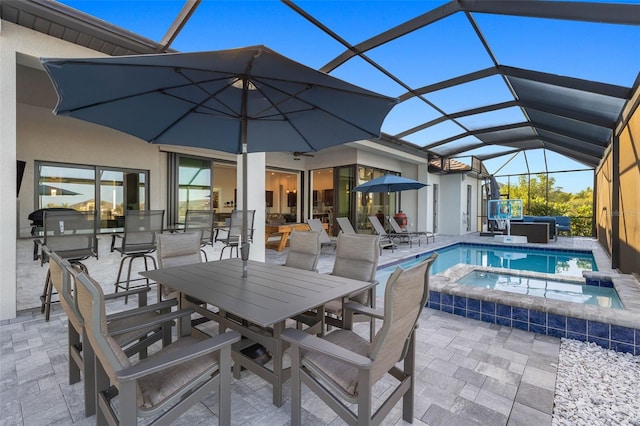 view of swimming pool with an in ground hot tub, a lanai, and a patio area