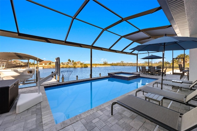 view of pool featuring a patio area, a water view, a dock, a lanai, and an in ground hot tub