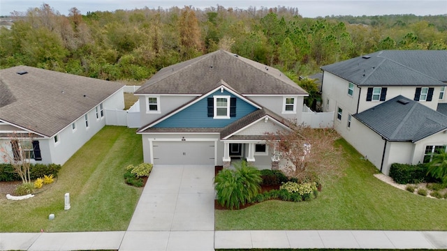 view of front of property with a front lawn and a garage