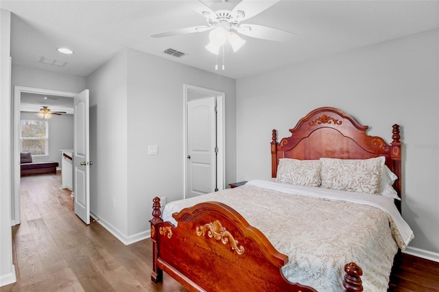 bedroom featuring ceiling fan and hardwood / wood-style floors