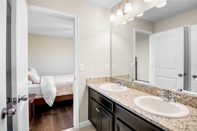 bathroom featuring vanity and hardwood / wood-style floors