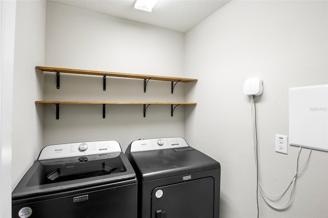 washroom with separate washer and dryer