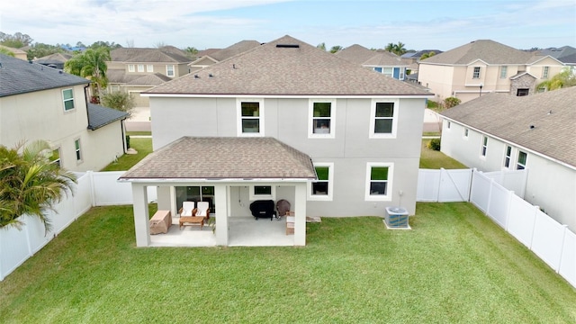 rear view of property with central AC, a yard, and a patio