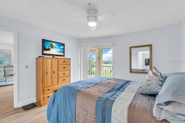 bedroom featuring ceiling fan, access to exterior, and light hardwood / wood-style flooring