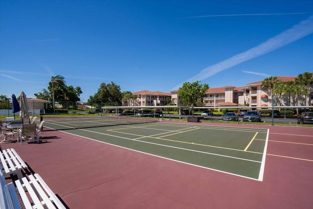 view of tennis court featuring basketball court