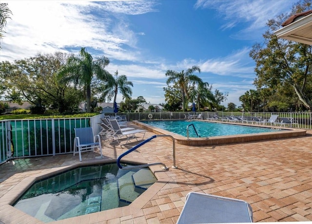 view of swimming pool with a patio