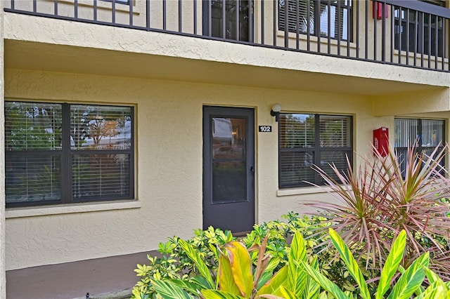 entrance to property with a balcony