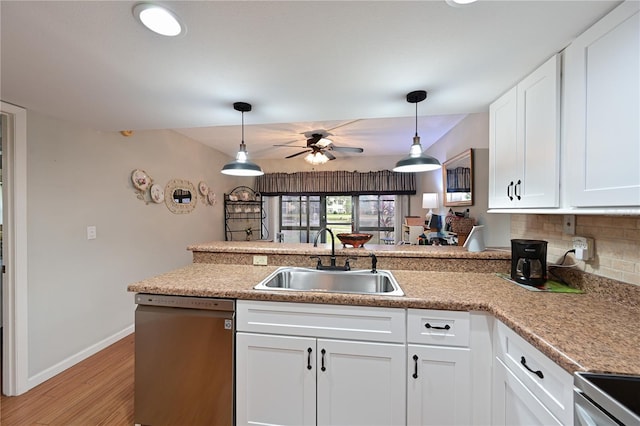 kitchen featuring white cabinetry, tasteful backsplash, sink, ceiling fan, and stainless steel dishwasher