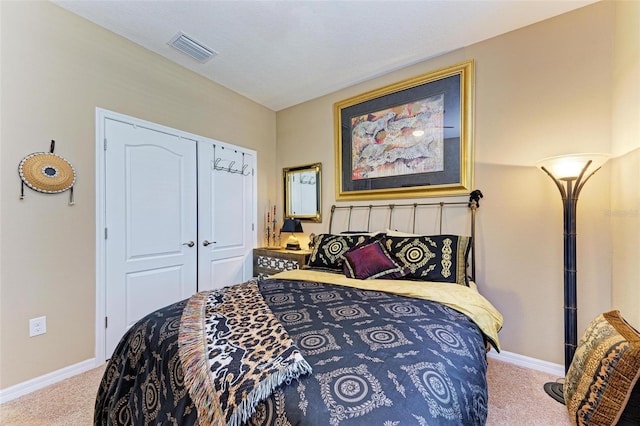 carpeted bedroom featuring a closet