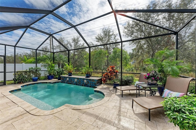 view of swimming pool featuring a lanai, a patio, and pool water feature