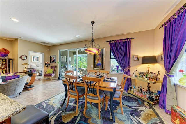 dining space featuring a textured ceiling