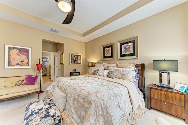 bedroom with ceiling fan and light colored carpet