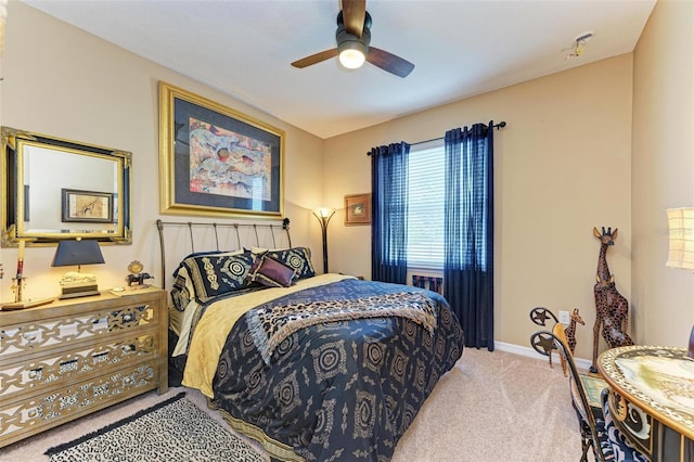 bedroom with light colored carpet and ceiling fan