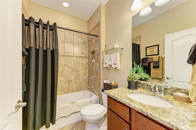 full bathroom with shower / tub combo with curtain, tile patterned flooring, vanity, a textured ceiling, and toilet