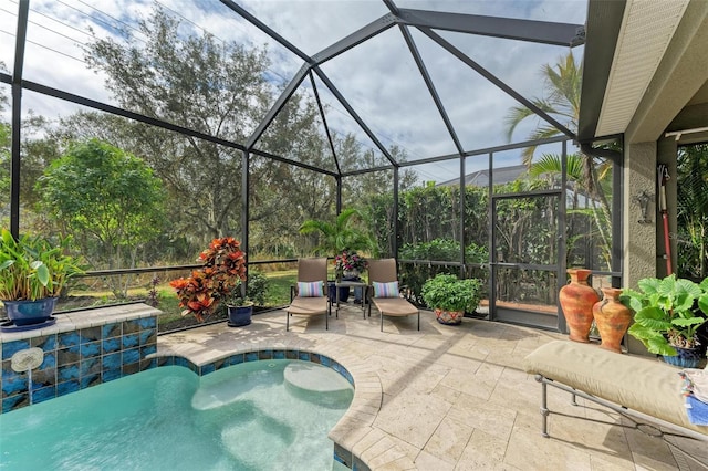 view of swimming pool featuring a patio and glass enclosure