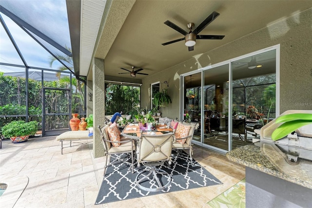 sunroom with a wealth of natural light and ceiling fan