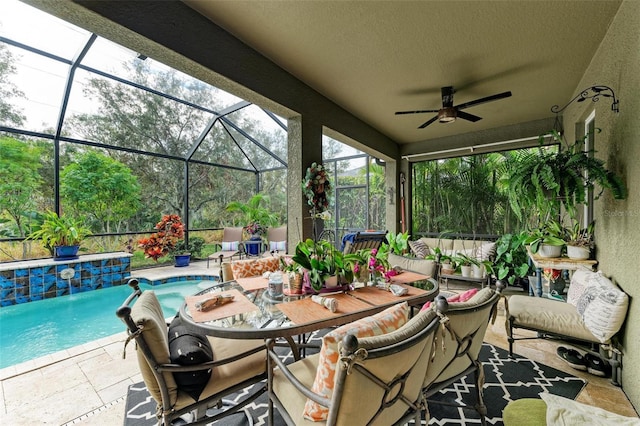 view of patio featuring a lanai and ceiling fan