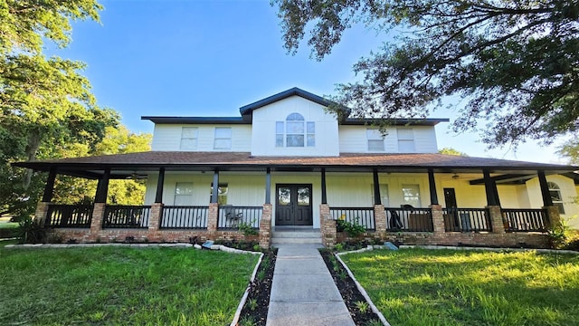 farmhouse with a front yard and a porch