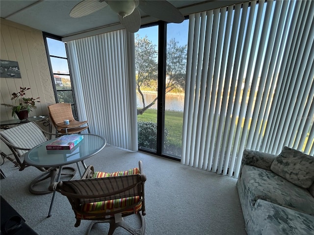 sunroom / solarium with a water view