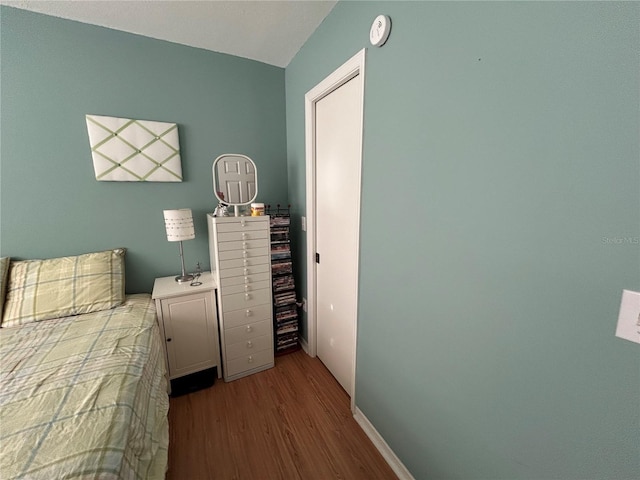 bedroom featuring light hardwood / wood-style flooring and a closet