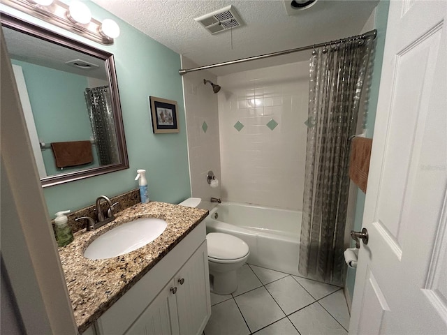 full bathroom with a textured ceiling, tile patterned floors, vanity, toilet, and shower / bath combo with shower curtain