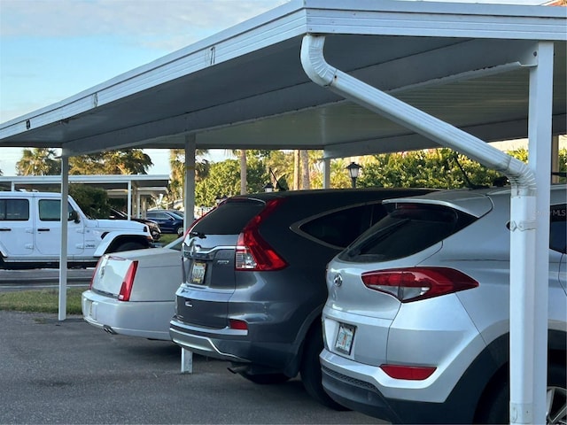 view of parking / parking lot with a carport