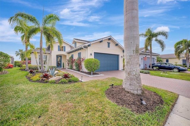 view of front of home featuring a front yard and a garage