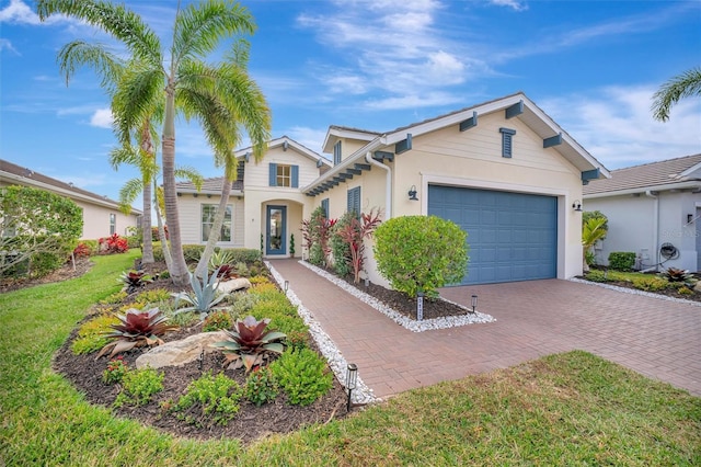 view of front facade featuring a garage and a front lawn