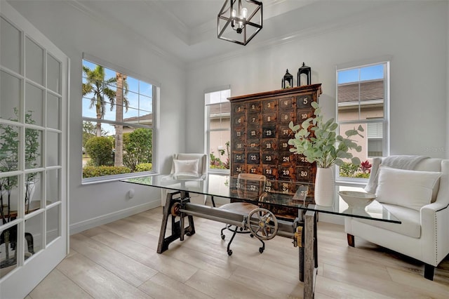 office area with crown molding, a notable chandelier, and a healthy amount of sunlight