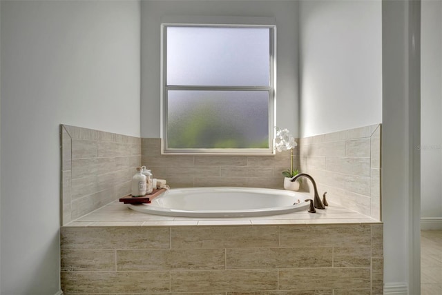 bathroom with tiled tub