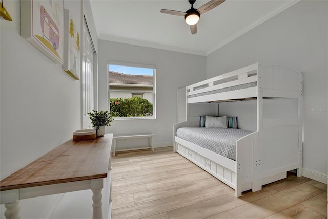 bedroom with ceiling fan, crown molding, and light wood-type flooring